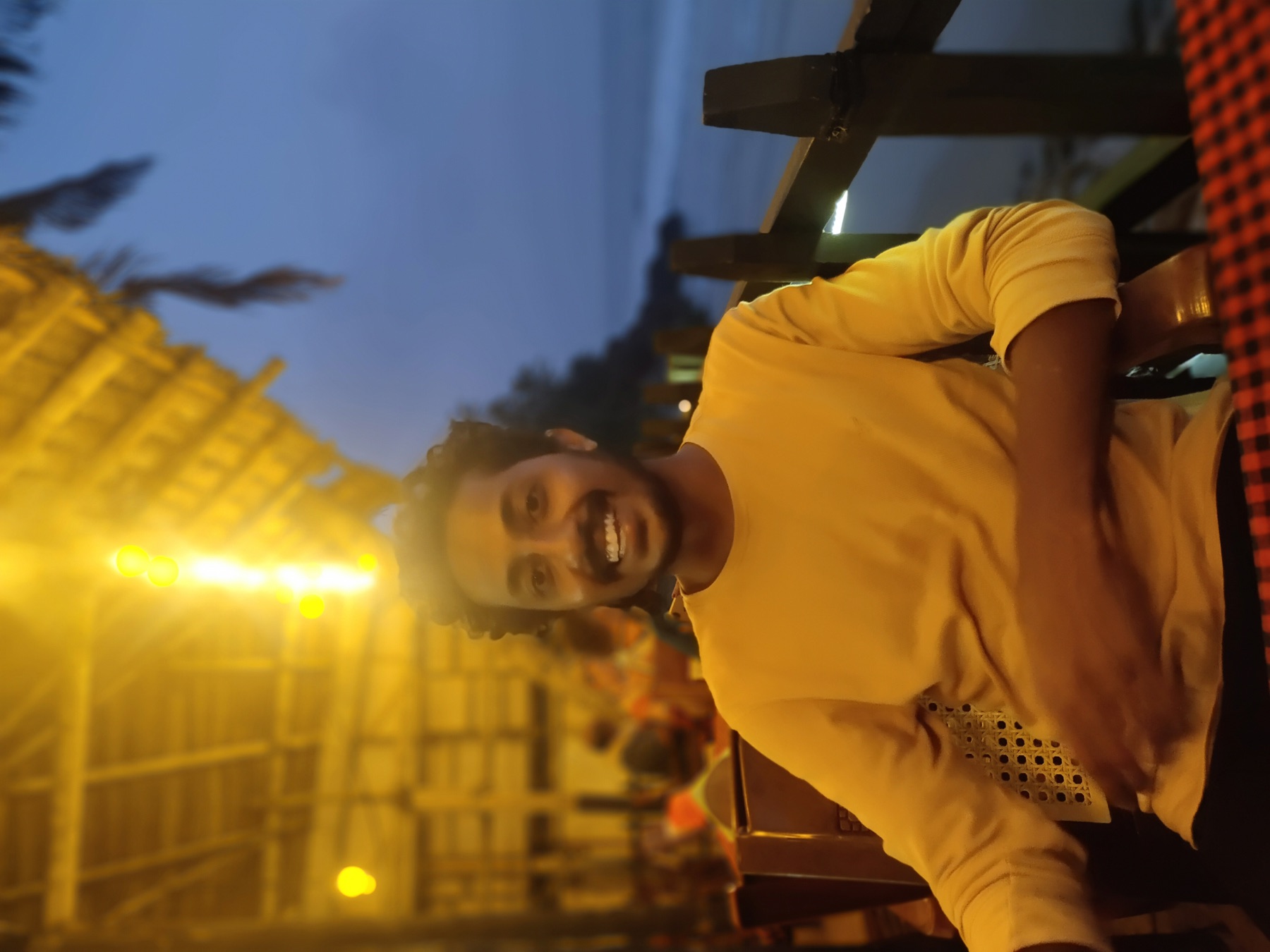 Dennis Pious seated by the sea in the evening