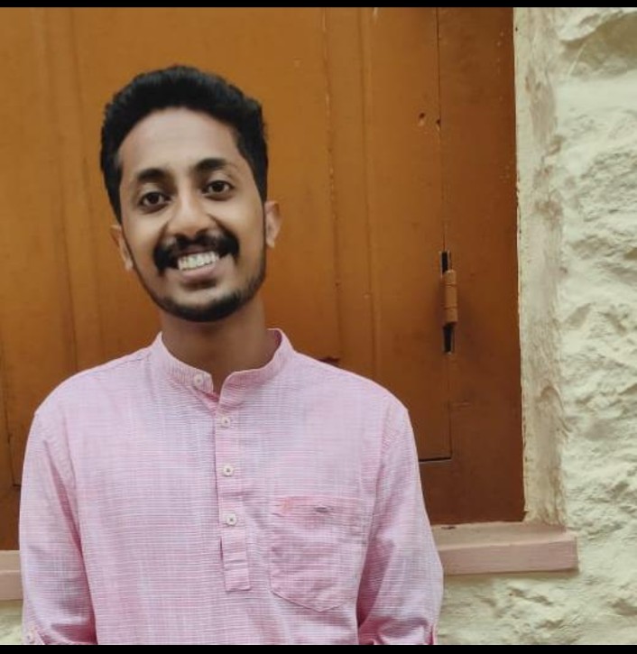 Dennis Pious wearing a pale pink kurta